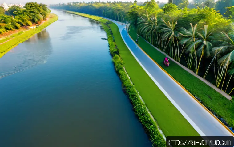 하천 복원 사업의 지속 가능성 평가 - Photorealistic wide-angle view of a restored urban river in Bangladesh, clear flowing water bordered...